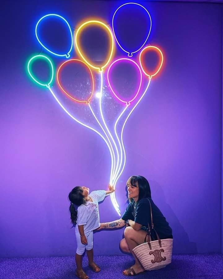 Balloon Bunch LED Neon sign by LEDNeons -  featuring a glowing cluster of colorful balloons, adding a festive and playful vibe to the space.