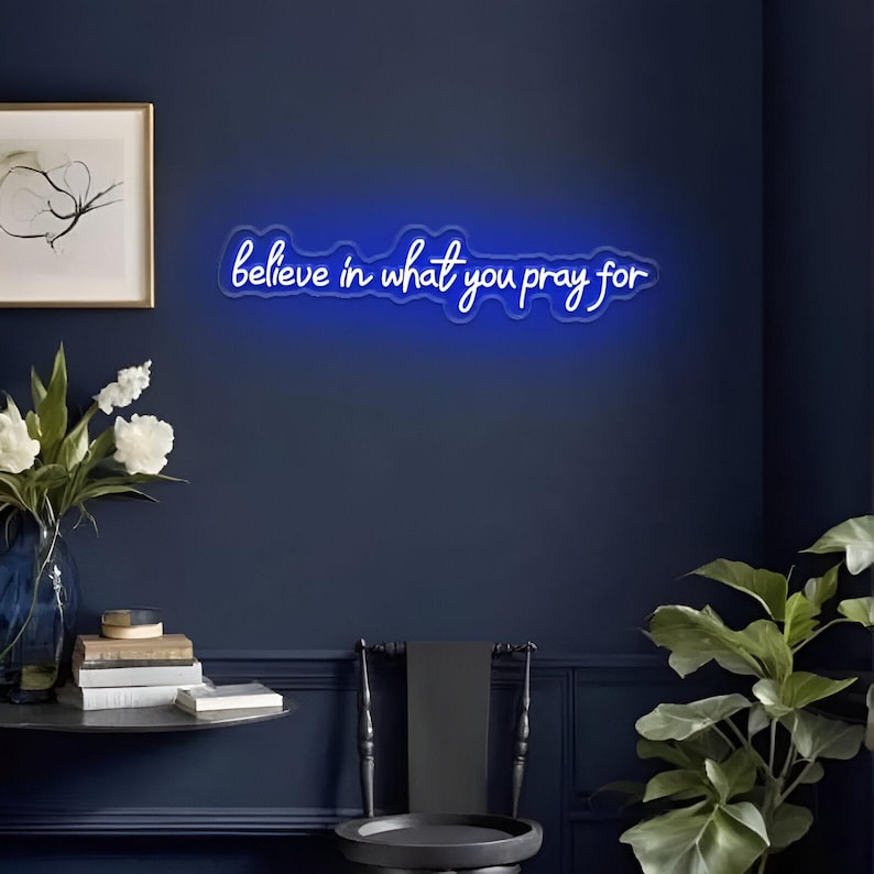 Believe in What You Pray For" LED Neon sign by LedNeons.com - glowing gently on a wall, adding a faith-inspired touch to a peaceful home setting.