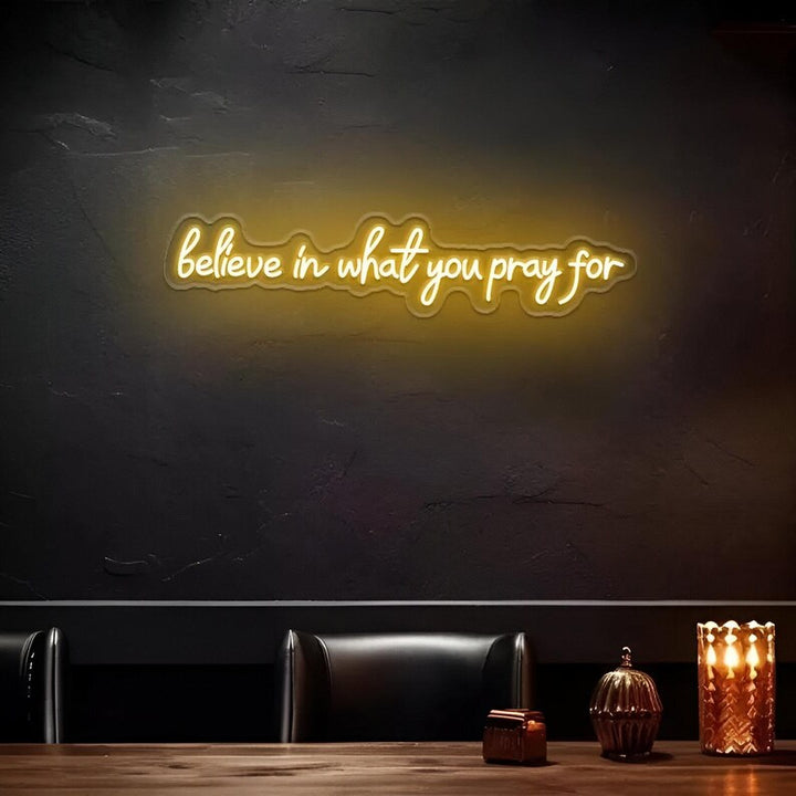 Believe in What You Pray For" LED Neon sign by LedNeons.com - glowing gently on a wall, adding a faith-inspired touch to a peaceful home setting.