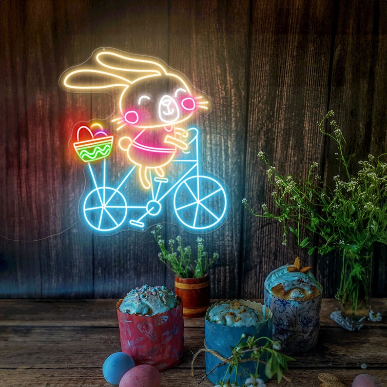 Bunny on Bike Easter neon sign glowing on wall by LEDNeons