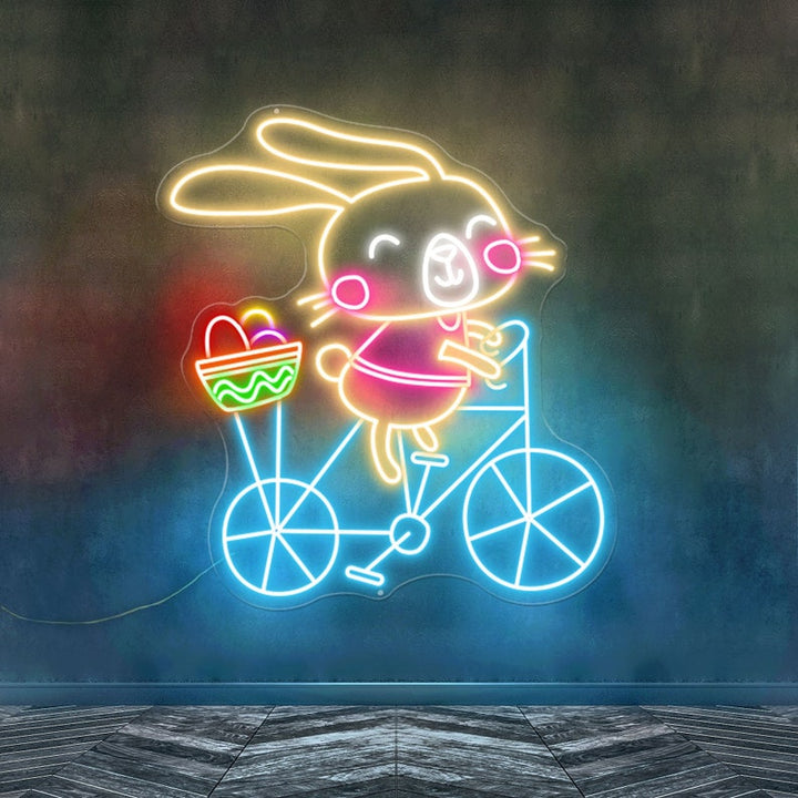 Bunny on Bike Easter neon sign glowing on wall by LEDNeons