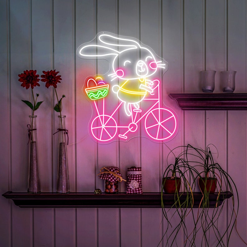 Bunny on Bike Easter neon sign glowing on wall by LEDNeons