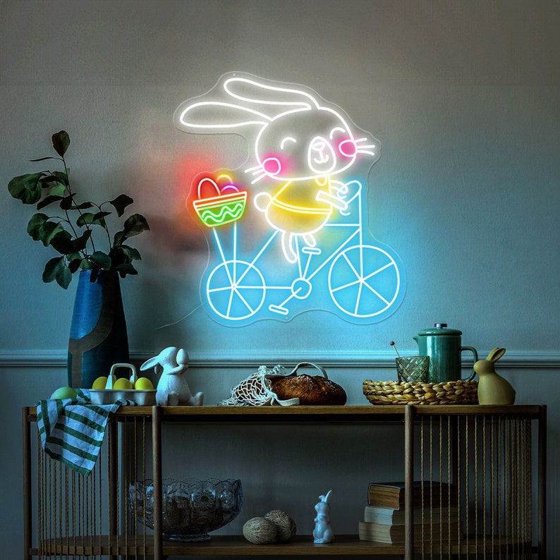Bunny on Bike Easter neon sign glowing on wall by LEDNeons