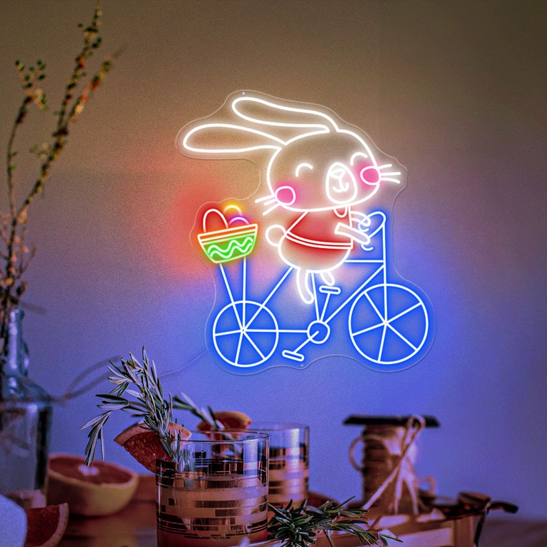 Bunny on Bike Easter neon sign glowing on wall by LEDNeons
