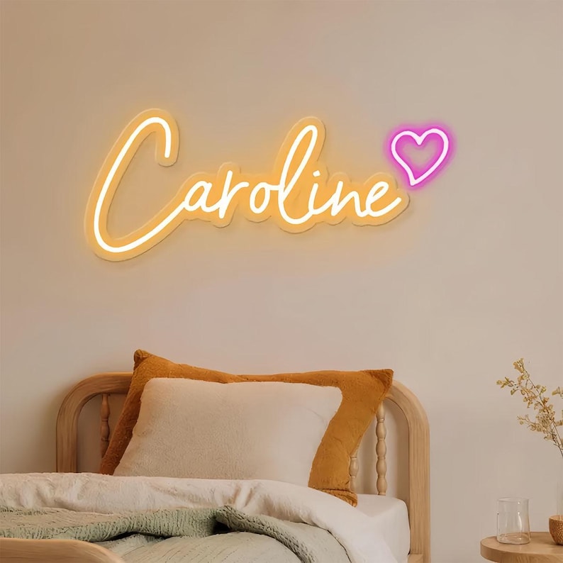 "Caroline" Name LED Neon sign by LedNeons.com - glowing on a wall, adding a custom and elegant touch to the space.