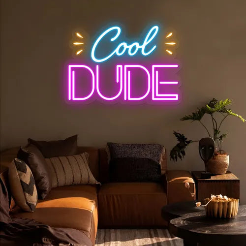 "Cool Dude" LED Neon sign by LEdneons.com - glowing brightly on a wall, adding a fun and playful touch to a casual or kids’ space.