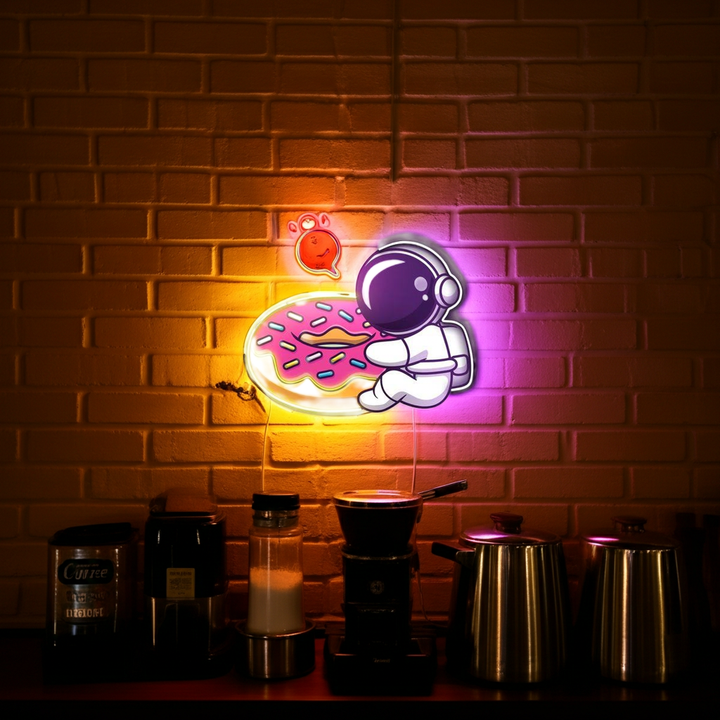 Donut Astronaut UV Light Neon Artwork by LEDNeons — a creative neon design featuring an astronaut holding or floating