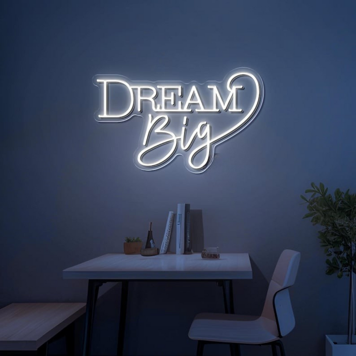 Dream Big LED neon sign by LEDNeons  -  glowing on a wall, creating a warm and motivational atmosphere in a cozy room or workspace.