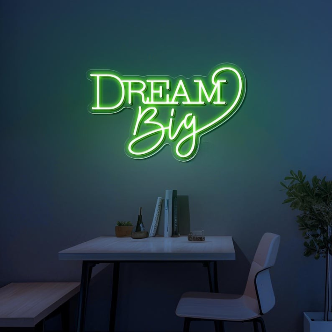 Dream Big LED neon sign by LEDNeons  -  glowing on a wall, creating a warm and motivational atmosphere in a cozy room or workspace.