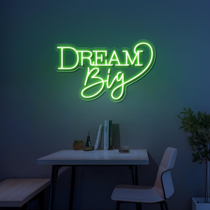 Dream Big LED neon sign by LEDNeons  -  glowing on a wall, creating a warm and motivational atmosphere in a cozy room or workspace.