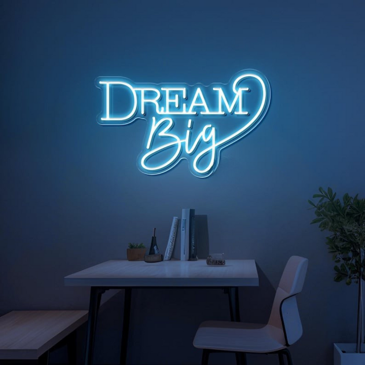 Dream Big LED neon sign by LEDNeons  -  glowing on a wall, creating a warm and motivational atmosphere in a cozy room or workspace.