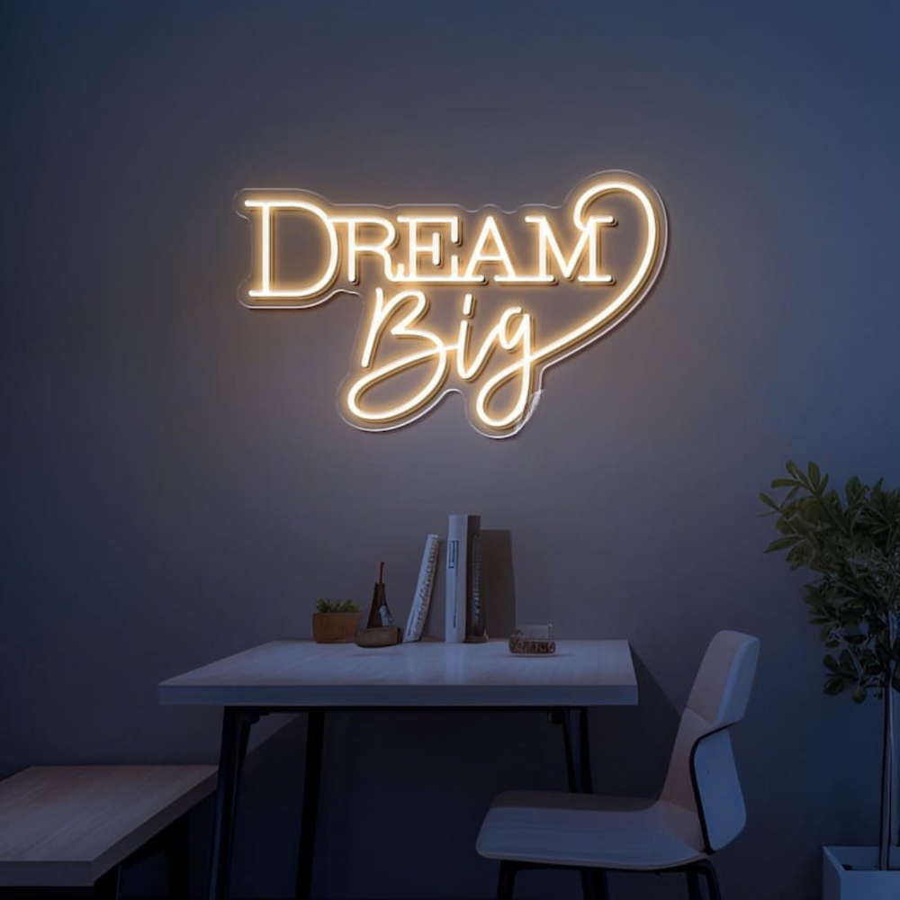 Dream Big LED neon sign by LEDNeons  -  glowing on a wall, creating a warm and motivational atmosphere in a cozy room or workspace.