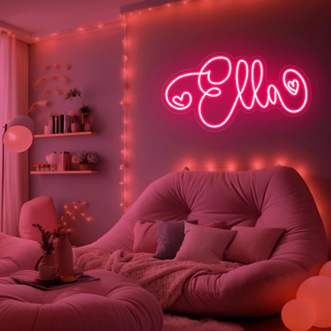 "Ella" Name LED Neon sign by LedNeons.com -  glowing softly on a wall, adding a personalized and stylish decorative touch.