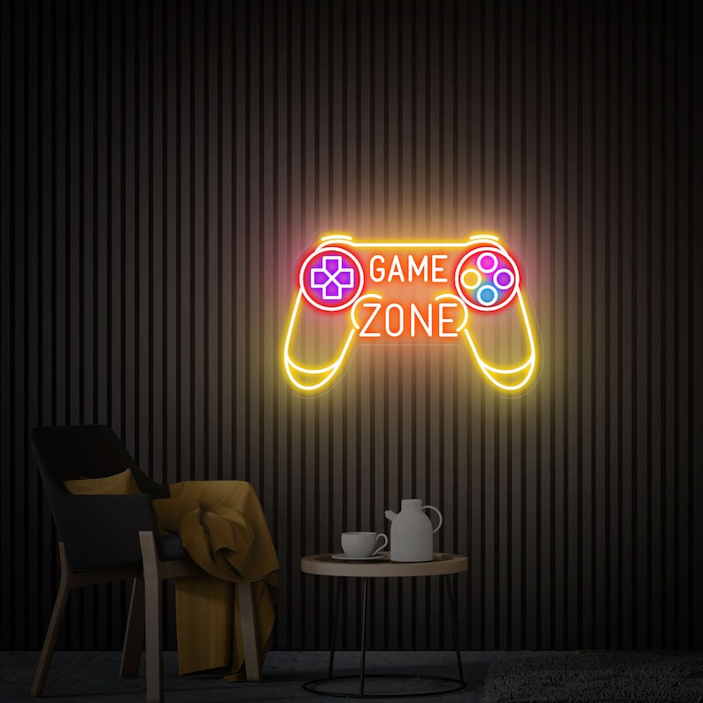 Game Zone LED Neon sign by LEDNeons  -  mounted on a wall, adding vibrant light to a modern gaming setup.