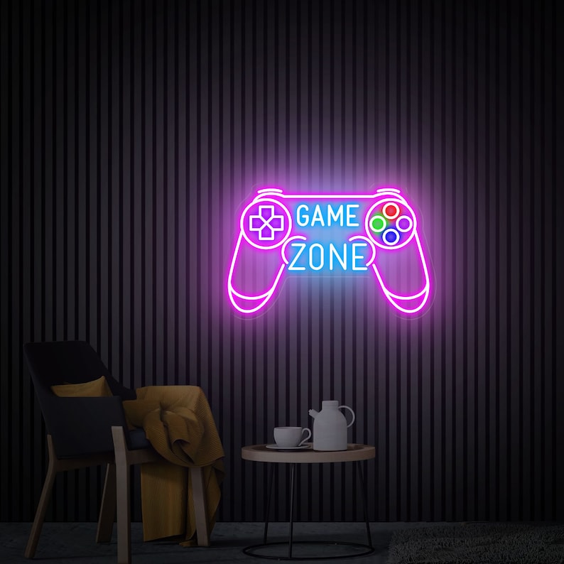 Game Zone LED Neon sign by LEDNeons  -  mounted on a wall, adding vibrant light to a modern gaming setup.
