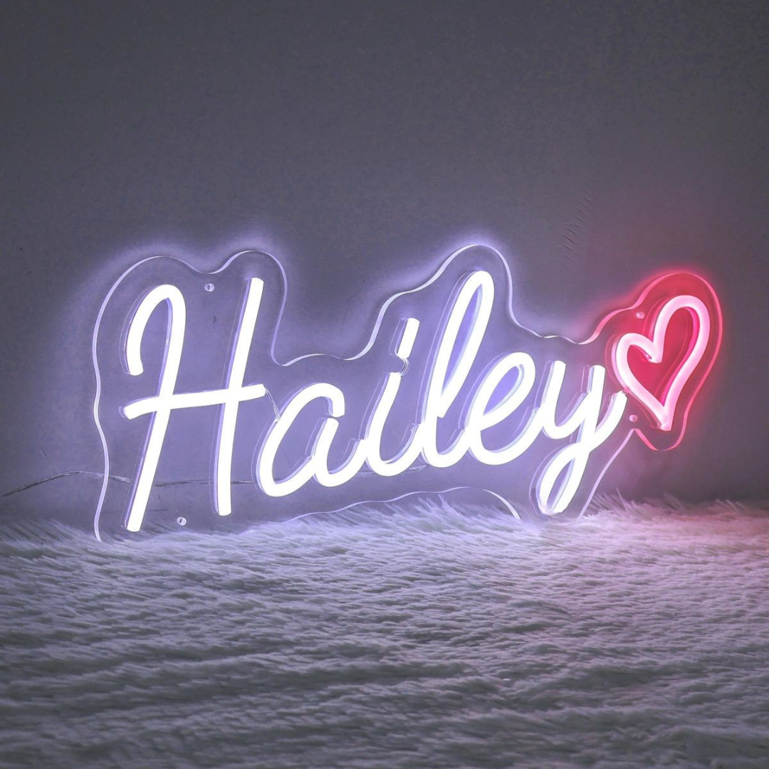 "Hailey" Name LED Neon sign by LEdNeons.com - glowing brightly on a wall, adding a custom and stylish touch to the decor.
