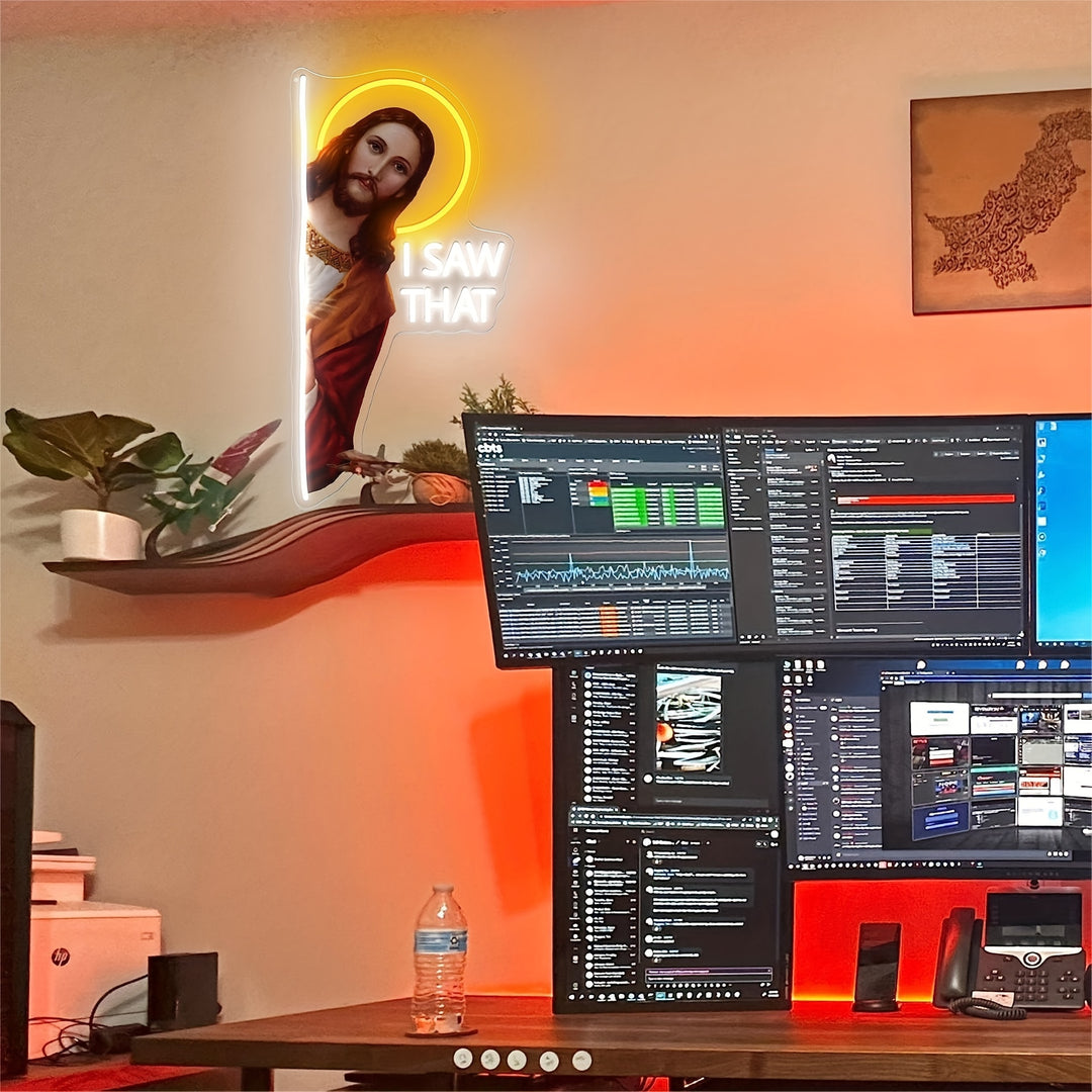 I Saw That  God" LED neon sign by LEDNeons - Glowing on a wall, featuring playful script text