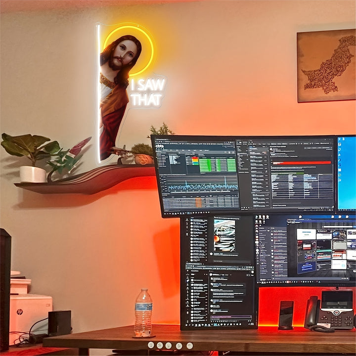 I Saw That  God" LED neon sign by LEDNeons - Glowing on a wall, featuring playful script text
