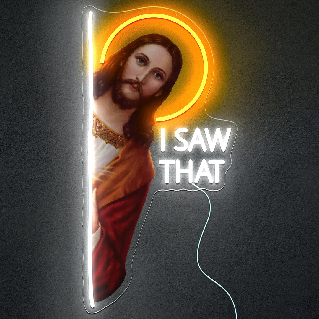 I Saw That  God" LED neon sign by LEDNeons - Glowing on a wall, featuring playful script text, adding a humorous and spiritual touch to home decor.