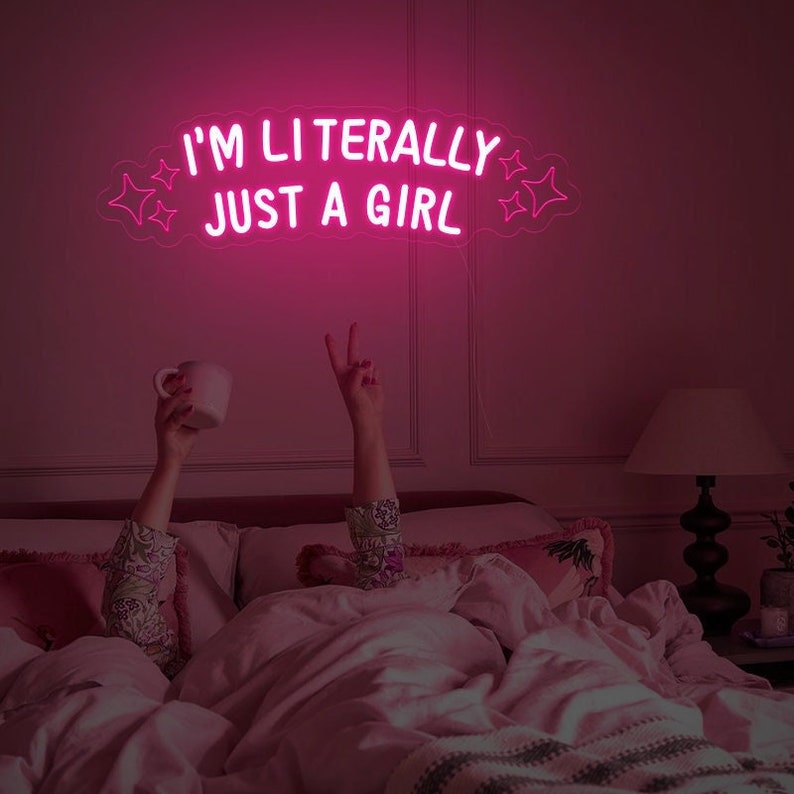 "I'm Literally Just A Girl" LED Neon sign by LEDNeons  - glowing in playful script on a wall, adding a fun and confident vibe to the space.