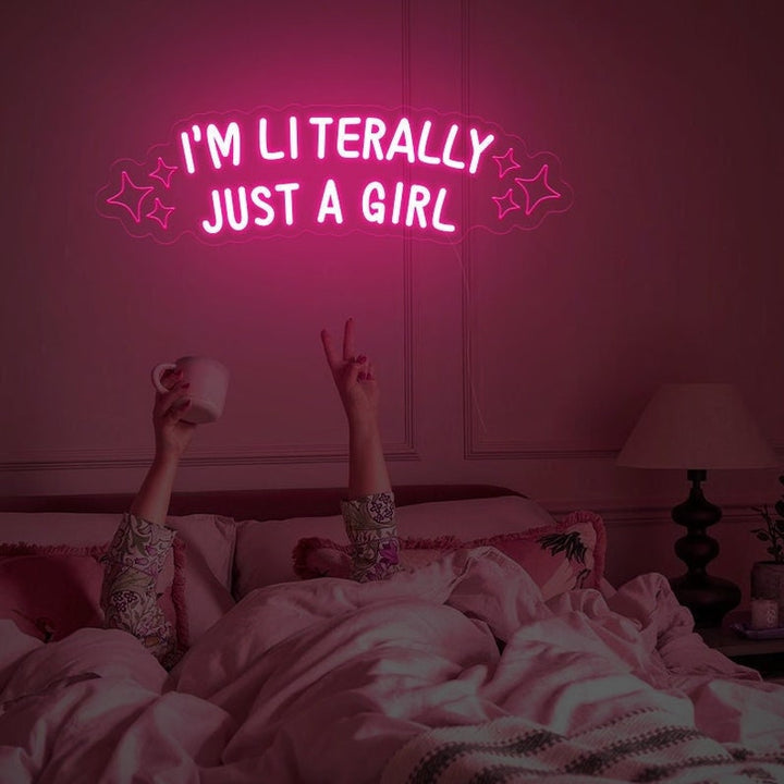 "I'm Literally Just A Girl" LED Neon sign by LEDNeons  - glowing in playful script on a wall, adding a fun and confident vibe to the space.