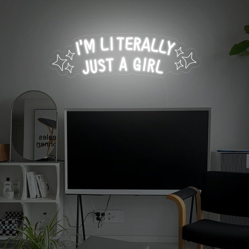 "I'm Literally Just A Girl" LED Neon sign by LEDNeons - glowing in playful script on a wall, adding a fun and confident vibe to the space.