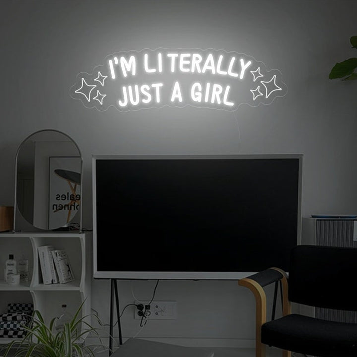 "I'm Literally Just A Girl" LED Neon sign by LEDNeons - glowing in playful script on a wall, adding a fun and confident vibe to the space.