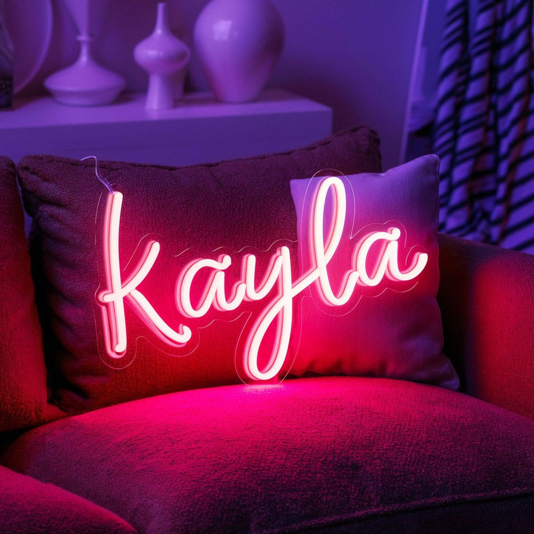 "Kayla" Name LED Neon sign by LedNeons.com - glowing on a wall, adding a custom and modern decorative accent.