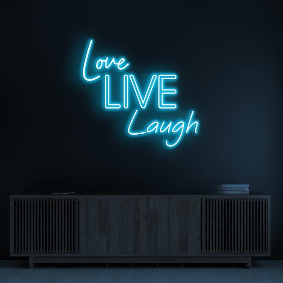 Love Live Laugh LED Neon Sign by LEDNeons  -  with glowing script text, ideal for adding a positive and uplifting vibe to home or office decor.