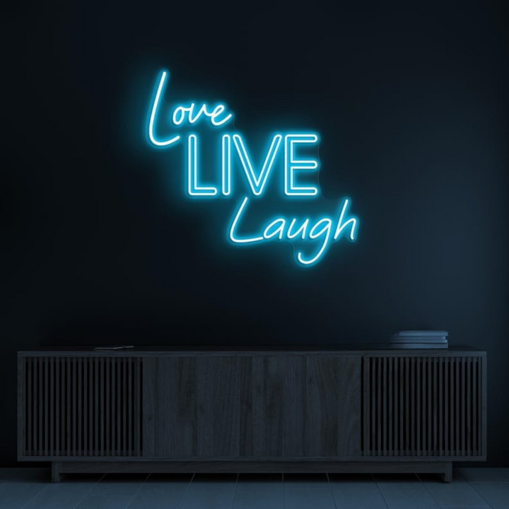 Love Live Laugh LED Neon Sign by LEDNeons  -  with glowing script text, ideal for adding a positive and uplifting vibe to home or office decor.