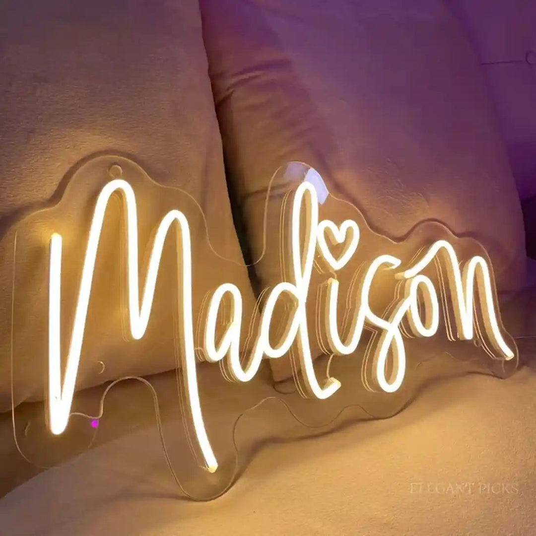 Madison name LED Neon sign by LEDNeons  -  glowing brightly on a wall, adding a personalized and modern touch to the decor