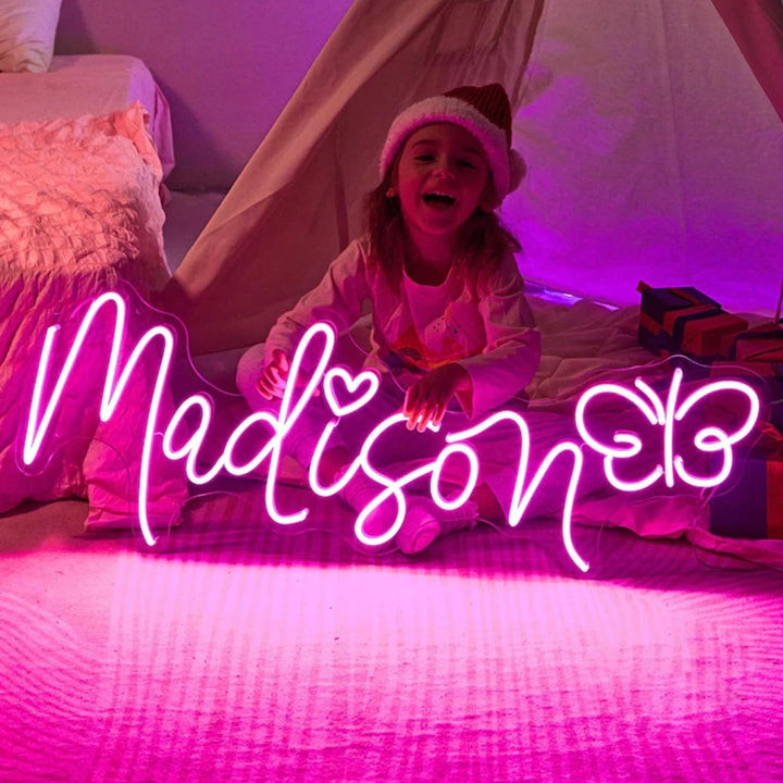 Madison name LED Neon sign by LEDNeons  -  glowing brightly on a wall, adding a personalized and modern touch to the decor
