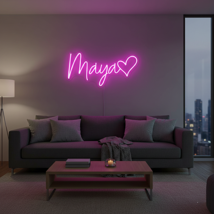 Maya Name LED Neon Sign by LedNeons.com -  glowing in elegant cursive font on a wall backdrop
