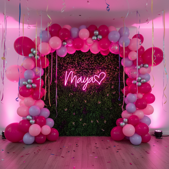 Maya Name LED Neon Sign by LedNeons.com -  glowing in elegant cursive font on a wall backdrop