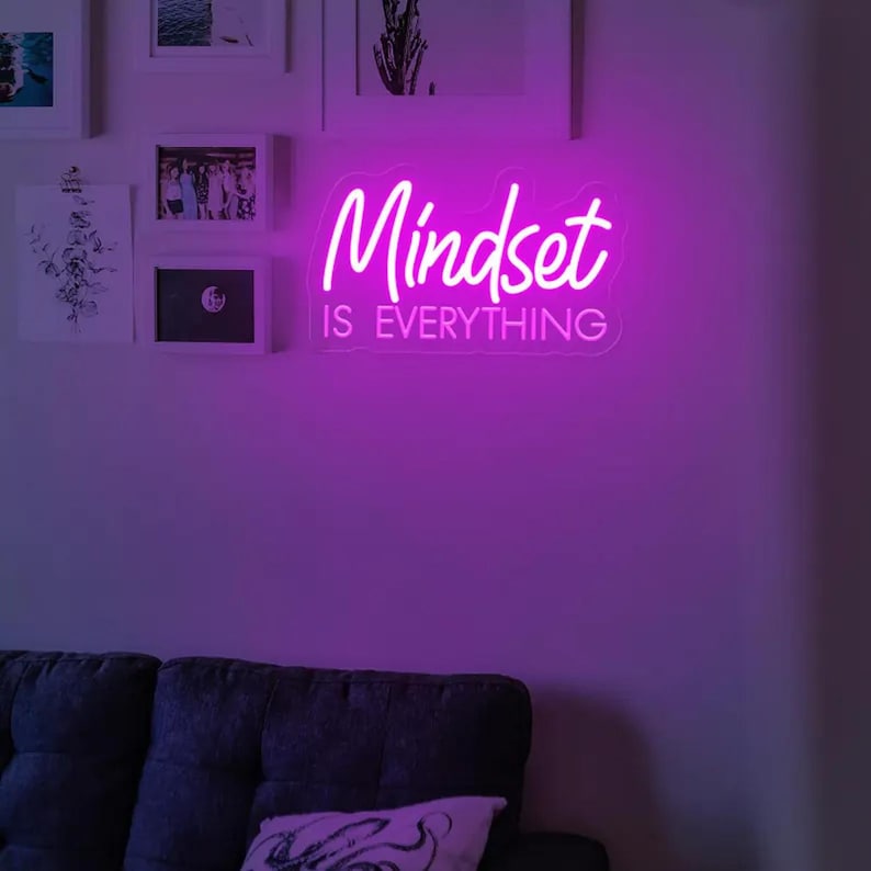 "Mindset is Everything" LED Neon sign by LEDNeons - Glowing brightly on a wall, creating a motivational atmosphere in a home office or personal workout space.