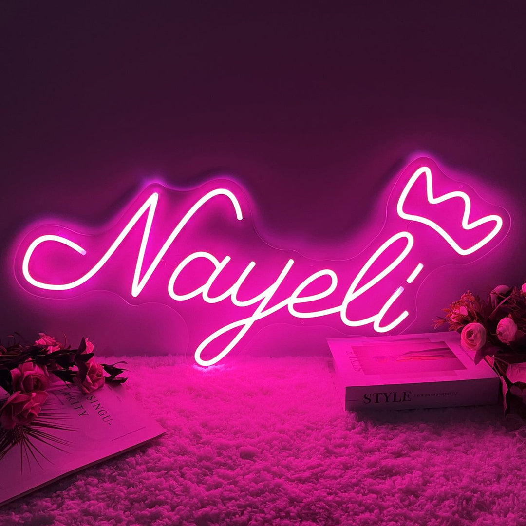 Nayeli Name LED Neon Sign by LEdNeons.com -  glowing in elegant cursive script on wall"
