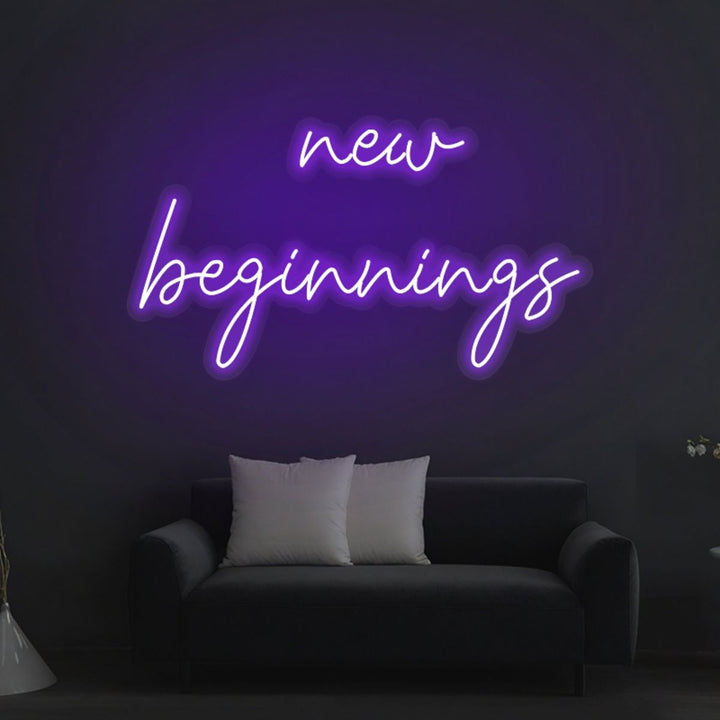 New Beginnings Neon Sign by LEDNeons glowing brightly on a wall, symbolizing hope, growth, and a fresh start.