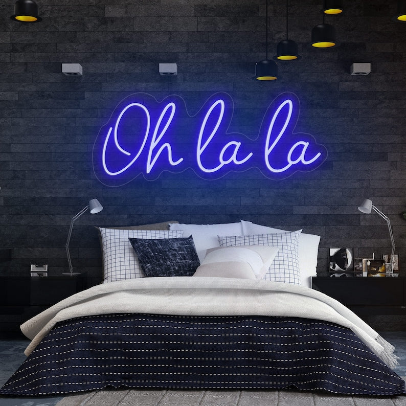 Oh La La! LED Neon Sign by LedNeons.com- with glowing cursive neon lettering, perfect for adding a chic and playful touch to bedrooms, or party spaces