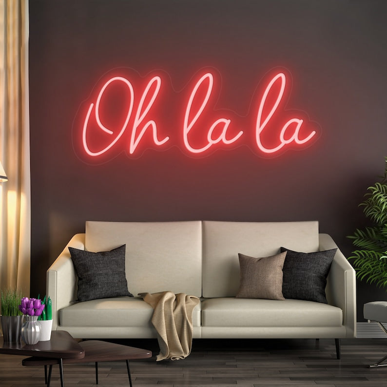 Oh La La! LED Neon Sign by LedNeons.com- with glowing cursive neon lettering, perfect for adding a chic and playful touch to bedrooms, or party spaces.