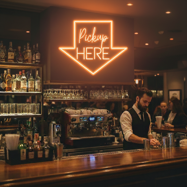 Pick Up Here" With Arrow Neon sign by LEDNeons - brightly glowing to direct customers to the pickup area.