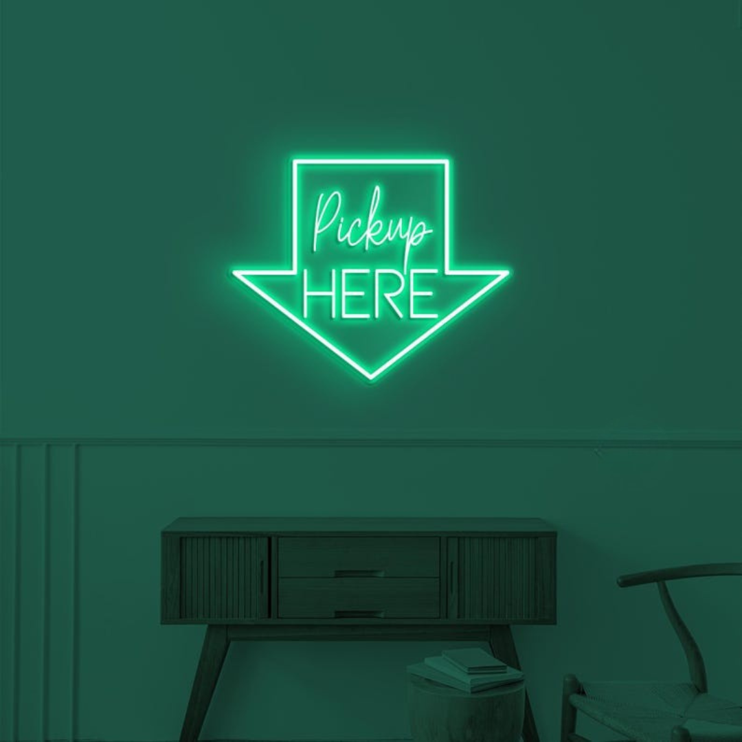 Pick Up Here" With Arrow Neon sign by LEDNeons - brightly glowing to direct customers to the pickup area.
