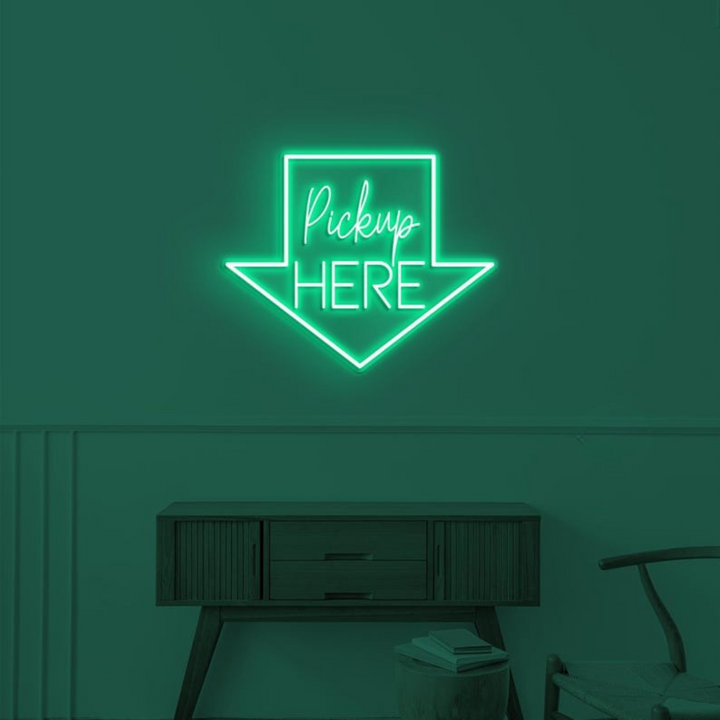 Pick Up Here" With Arrow Neon sign by LEDNeons - brightly glowing to direct customers to the pickup area.