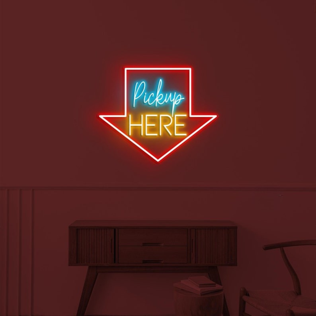 Pick Up Here" With Arrow Neon sign by LEDNeons - brightly glowing to direct customers to the pickup area.