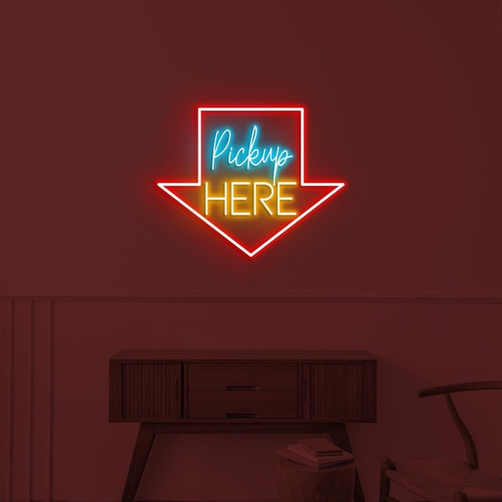 Pick Up Here" With Arrow Neon sign by LEDNeons - brightly glowing to direct customers to the pickup area.
