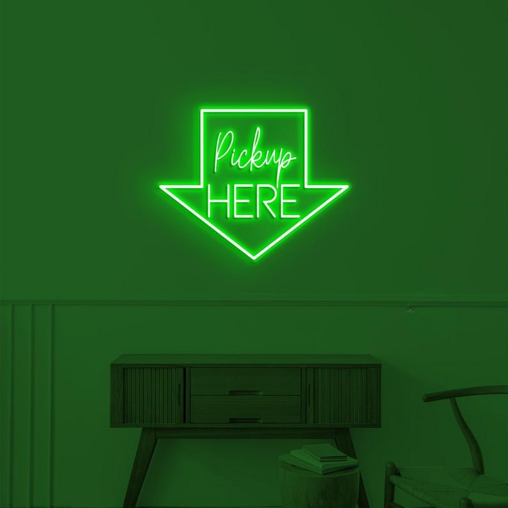 Pick Up Here" With Arrow Neon sign by LEDNeons - brightly glowing to direct customers to the pickup area.