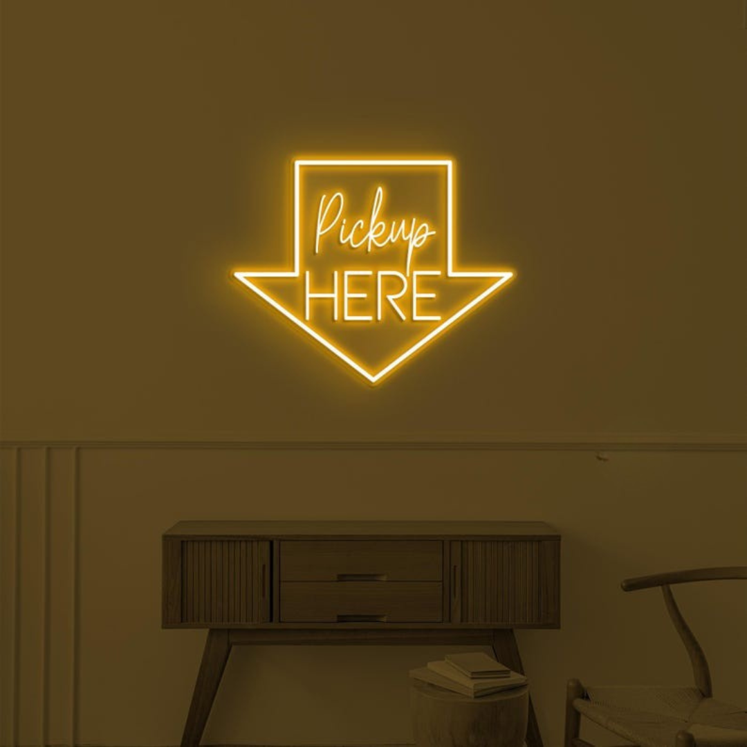 Pick Up Here" With Arrow Neon sign by LEDNeons - brightly glowing to direct customers to the pickup area.