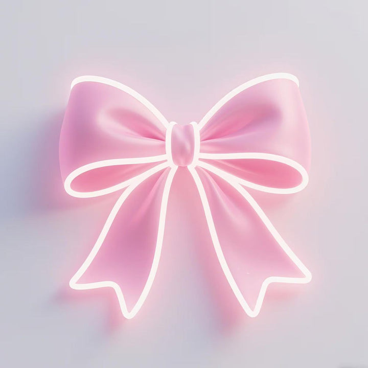 Pink bow-shaped LED Neon sign by LEDNeons - glowing softly on a wall, adding a cute and feminine touch to the decor.