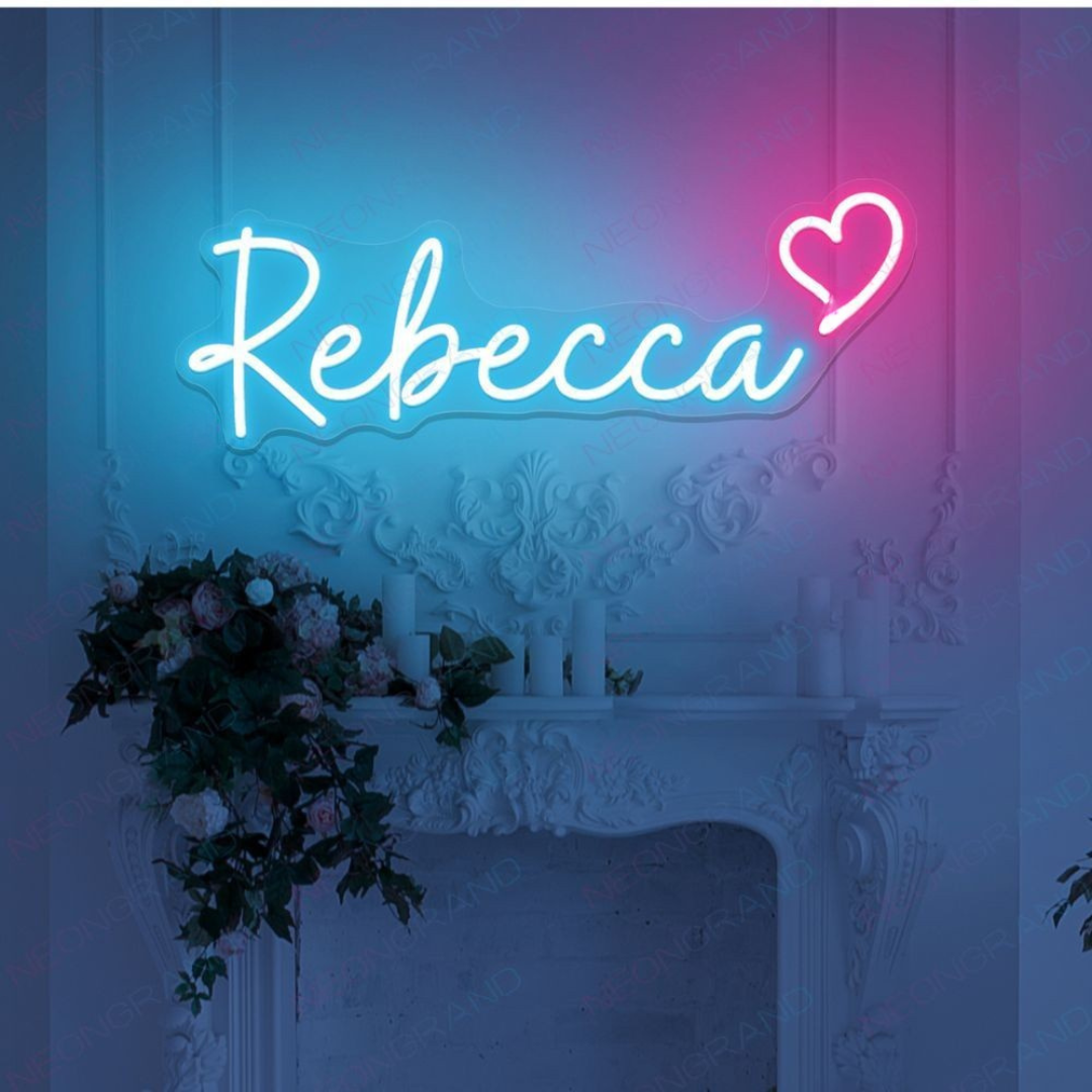 "Rebecca" Name LED Neon sign by LedNeons.com - glowing on a wall, adding a personalized and stylish decorative touch.