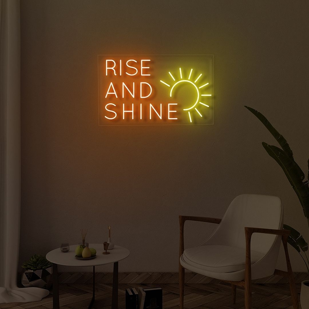 "Rise and Shine" LED Neon sign by Ledneons.com - glowing brightly on a wall, adding a cheerful and uplifting vibe to the room.