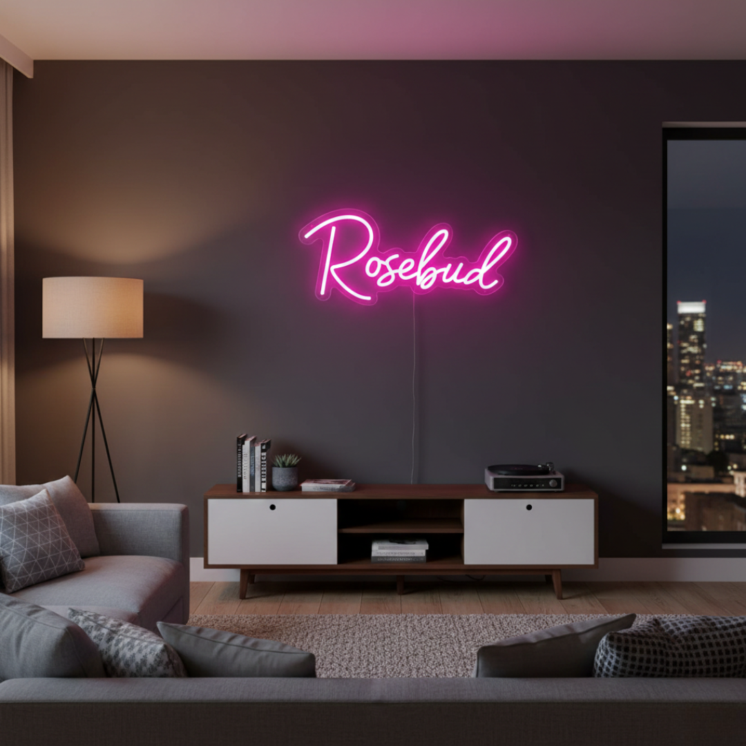 Rosebud Name LED Neon sign by LedNeons.com - glowing softly on a wall, adding a whimsical and personalized decorative touch.
